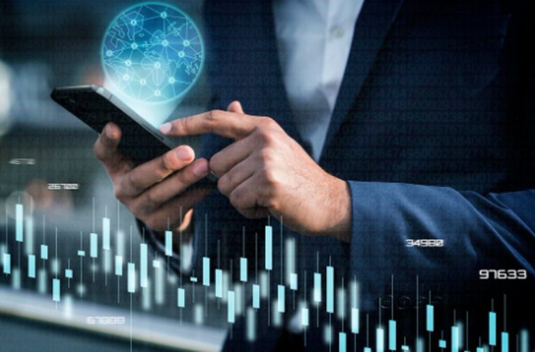 Business professional using a smartphone to analyze financial charts and data, symbolizing modern strategies for investing in Artificial Intelligence in the global market.