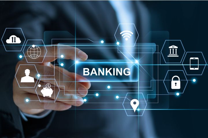 A business professional interacts with a digital interface displaying futuristic banking icons such as Wi-Fi, security, and finance, symbolizing innovation in the best online banks for beginners.